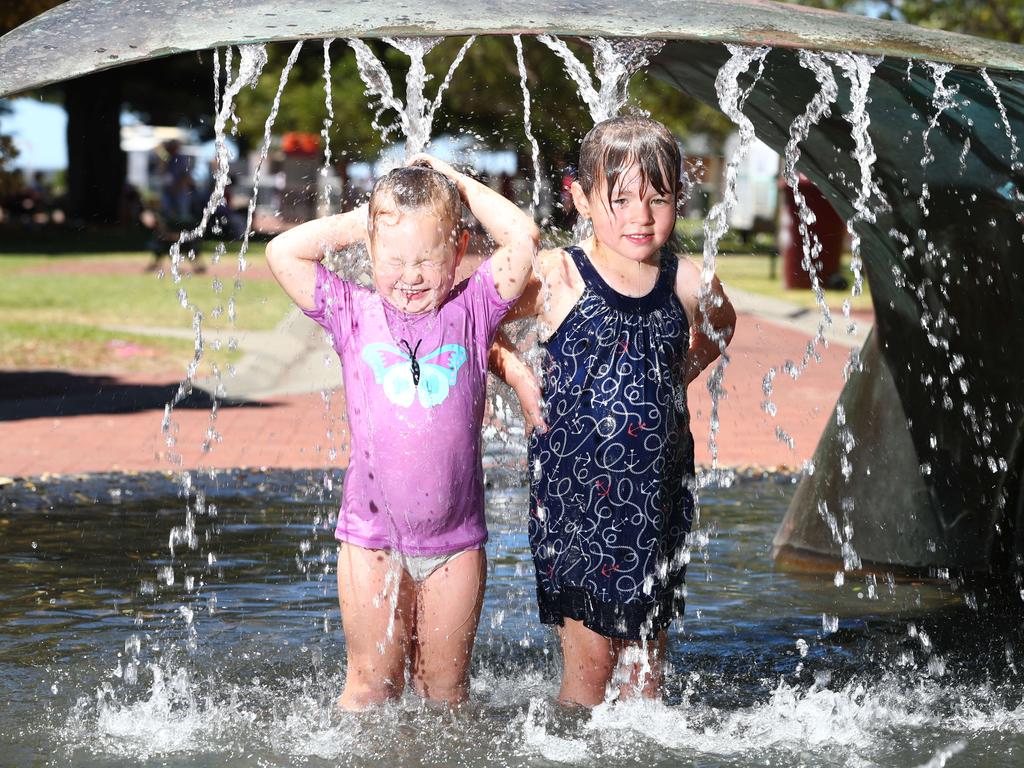 Isabella, 3, and Sophie,4, cool down at Victor Harbor. Picture:Tait Schmaal