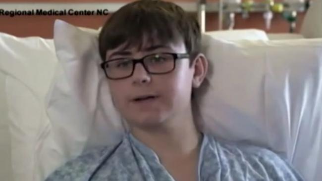 In this image taken from video provided by New Hanover Regional Medical Center, 16-year-old Hunter Treschl, of Colorado Springs, Colo., speaks during an interview at New Hanover Regional Medical Center in Wilmington, N.C., Tuesday, June 16, 2015. The teen was seriously wounded in a shark attack. "We were just playing around in the waves, and I felt a hit on my left calf," Treschl said in a videotaped interview released Tuesday night by the hospital where he is being treated. "I thought it felt like a big fish, and I started moving away. And then the shark bit my arm _ off." (New Hanover Regional Medical Center via AP)