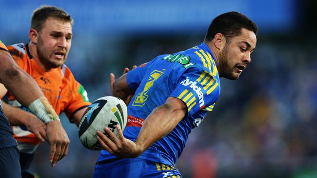 Parramatta's Jarryd Hayne gets a flick pass away against the Knights.