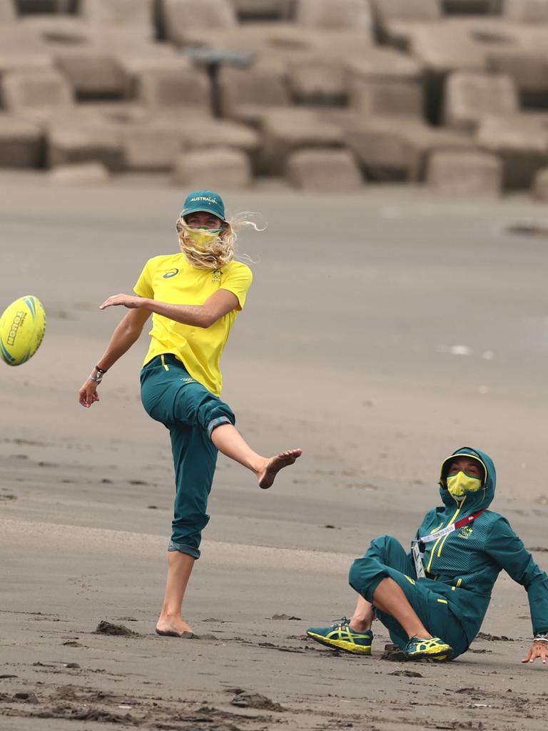 Aa spot of beach footy with fellow surfing superstar Stephanie Gilmore. Picture: Getty Images