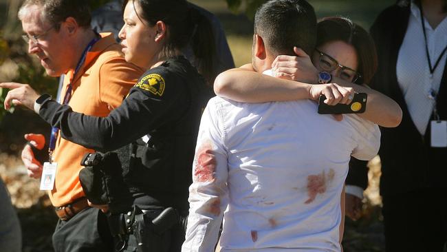 A couple embraces following a shooting that killed multiple people at a social services facility, Wednesday, Dec. 2, 2015, in San Bernardino, Calif. (David Bauman/The Press-Enterprise via AP) MAGS OUT; MANDATORY CREDIT; LOS ANGELES TIMES OUT