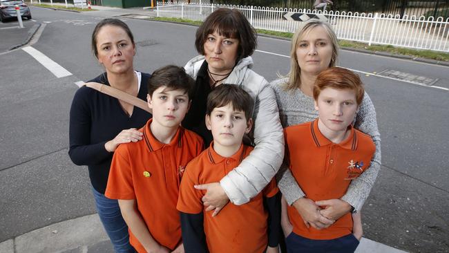 Concerned parents Beth Halls, Elena Markushina with her children Roman and Maxim, Jo Murphy and son Cade near the Richmond injection rooms. Picture: David Caird