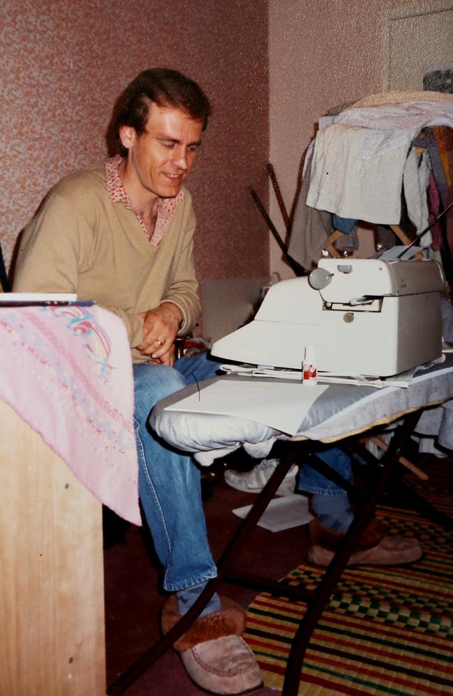 The devoted writer at work at the ironing board in London in 1983. Picture: SUPPLIED
