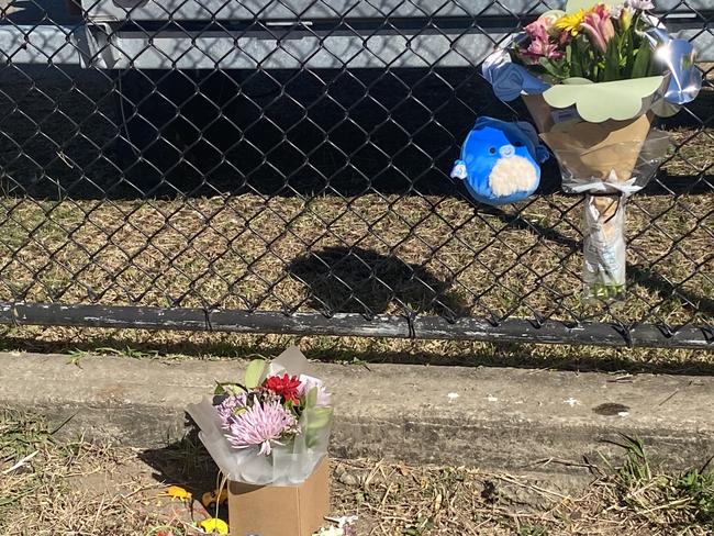 Flowers and toys have been left at a memorial space at Gate 8 of the Rockhampton Showgrounds in tribute to a three-year-old boy who tragically died after being hit by a car. Photos: Geordi Offord