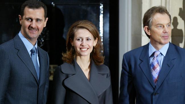 The couple with then British PM Tony Blair outside No. 10 Downing Street in 2002. Picture: AFP