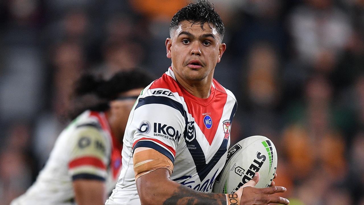 Latrell Mitchell of the Roosters makes a break during the win over the Tigers