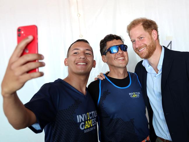 DUESSELDORF, GERMANY - SEPTEMBER 11: Prince Harry, Duke of Sussex meets competitors as he attends the track and field at the athletics track during day two of the Invictus Games DÃÂ¼sseldorf 2023 on September 11, 2023 in Duesseldorf, Germany. (Photo by Chris Jackson/Getty Images for the Invictus Games Foundation)