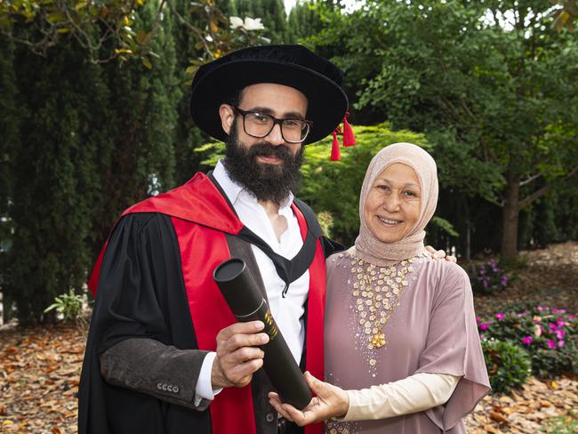 PhD graduate Basem Aly is congratulated by mum Samia Elhabab at a UniSQ graduation ceremony at The Empire, Wednesday, October 30, 2024. Picture: Kevin Farmer