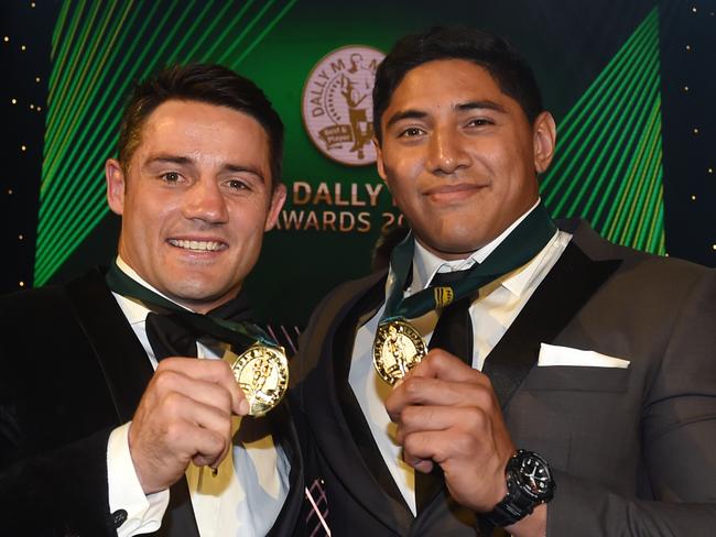 Winners of the Dally M Award North Queensland Cowboys' NRL player Jason Taumalolo (right) and Melbourne Storm NRL player Cooper Cronk pose for a photograph in Sydney on Wednesday, Sept. 28, 2016. The awards are named in honour of former Australian Rugby League great Herbert Henry ÒDallyÓ Messenger, and were introduced in 1980. (AAP Image/Paul Miller) NO ARCHIVING