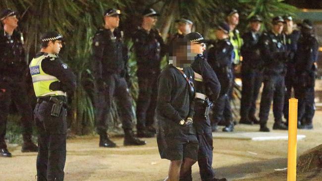 Police watched as youths gathered outside St Kilda McDonald’s. Picture: Mark Stewart