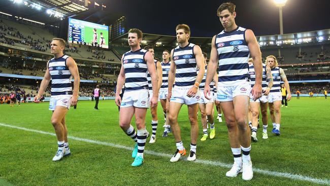 Geelong players exit the MCG after losing to Collingwood.