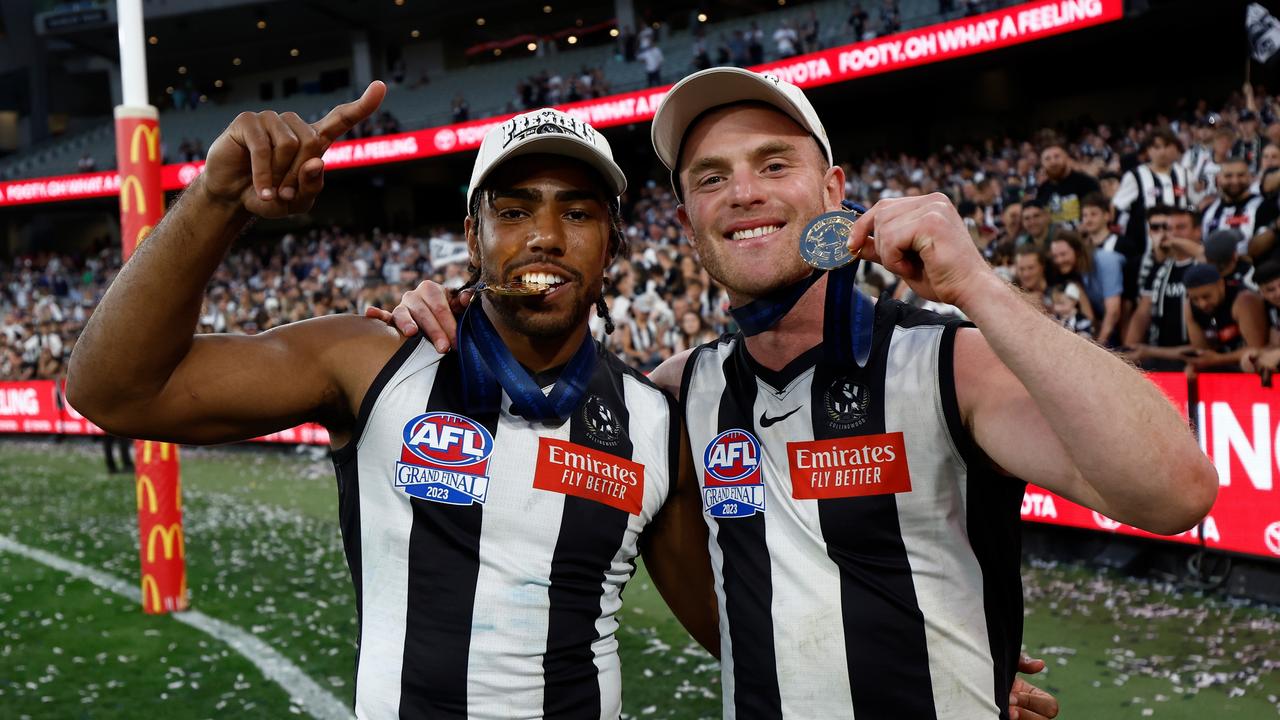 Isaac Quaynor of the Magpies and Tom Mitchell. Photo by Michael Willson/AFL Photos via Getty Images.