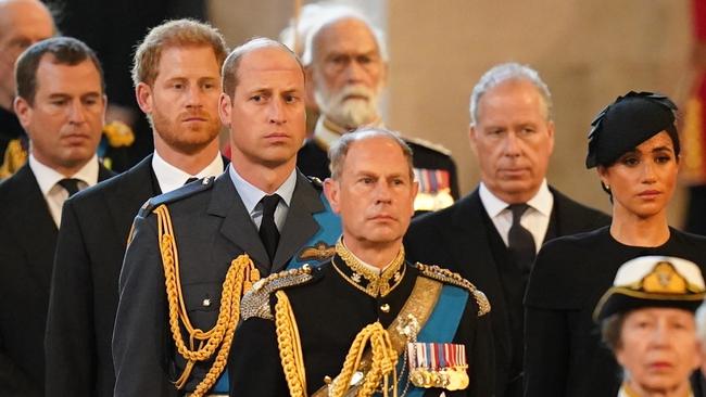 Peter Phillips, Prince Harry, Duke of Sussex, Prince William, Prince of Wales, Edward, Earl of Wessex, David Armstrong-Jones, Earl of Snowdon, Meghan, Duchess of Sussex and Anne, Princess Royal follow the bearer party carrying the coffin of Queen Elizabeth II into Westminster Hall.