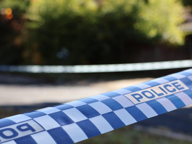 Police tape at the scene of a fatal house fire on Giltinan Place, in the ACT suburb of Holt. on May 22, 2024. Picture: Blake Foden