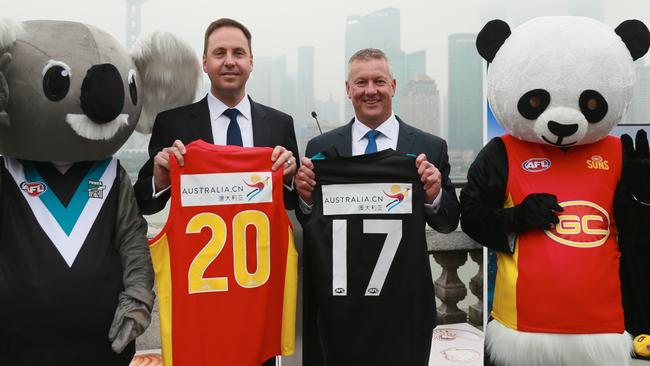 Steve Ciobo MP (left) and AFL general manager of football operations Mark Evans announcing Tourism Australia as the new partner of the first AFL Premiership Season game in Shanghai, China, between the Gold Coast Suns and Port Adelaide. Photo: supplied.