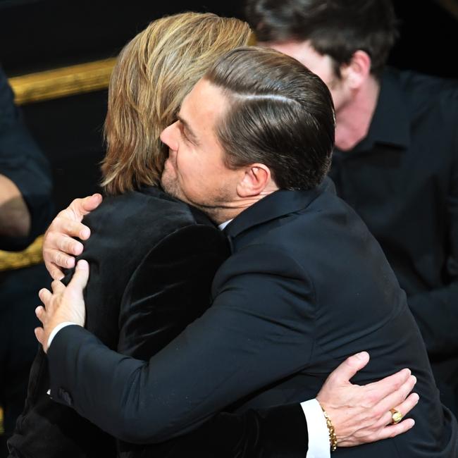 The Once Upon a Time in Hollywood stars give each other a hug. Picture: Kevin Winter/Getty Images)