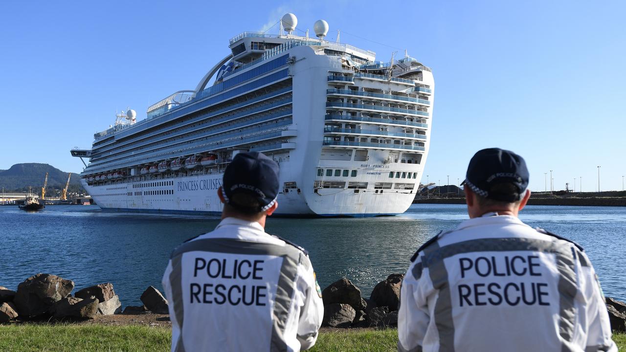 NSW Police Rescue officers look on as the Ruby Princess, with crew only on-board, docks at Port Kembla, Wollongong. Picture: Dean Lewins/AAP