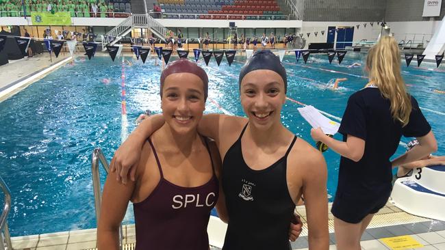 Jenna Forrester of St Peters and Sophie Martin from St Margaret’s at the QGSSSA swim meet in March