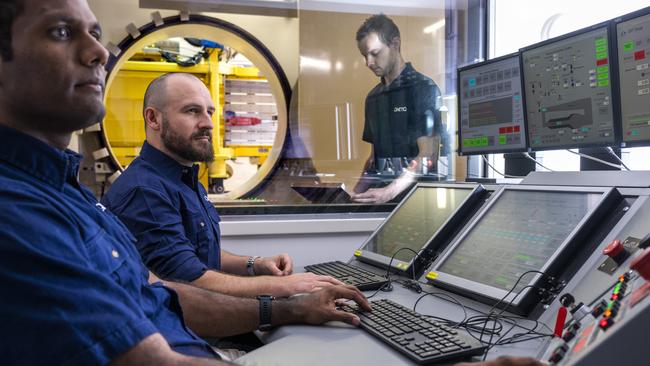 QinetiQ engineers at work in their South Melbourne office.