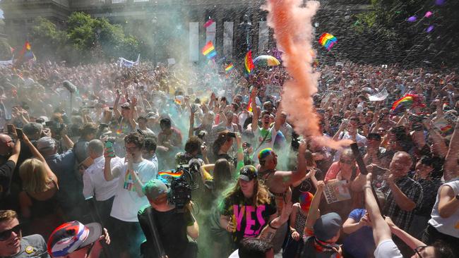 The crowd react to the same-sex marriage postal survey Yes result in front of the State Library of Victoria in Melbourne.