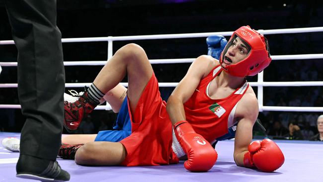 Khelif and Anna Luca Hamori hit the deck in their bout. Picture: AFP