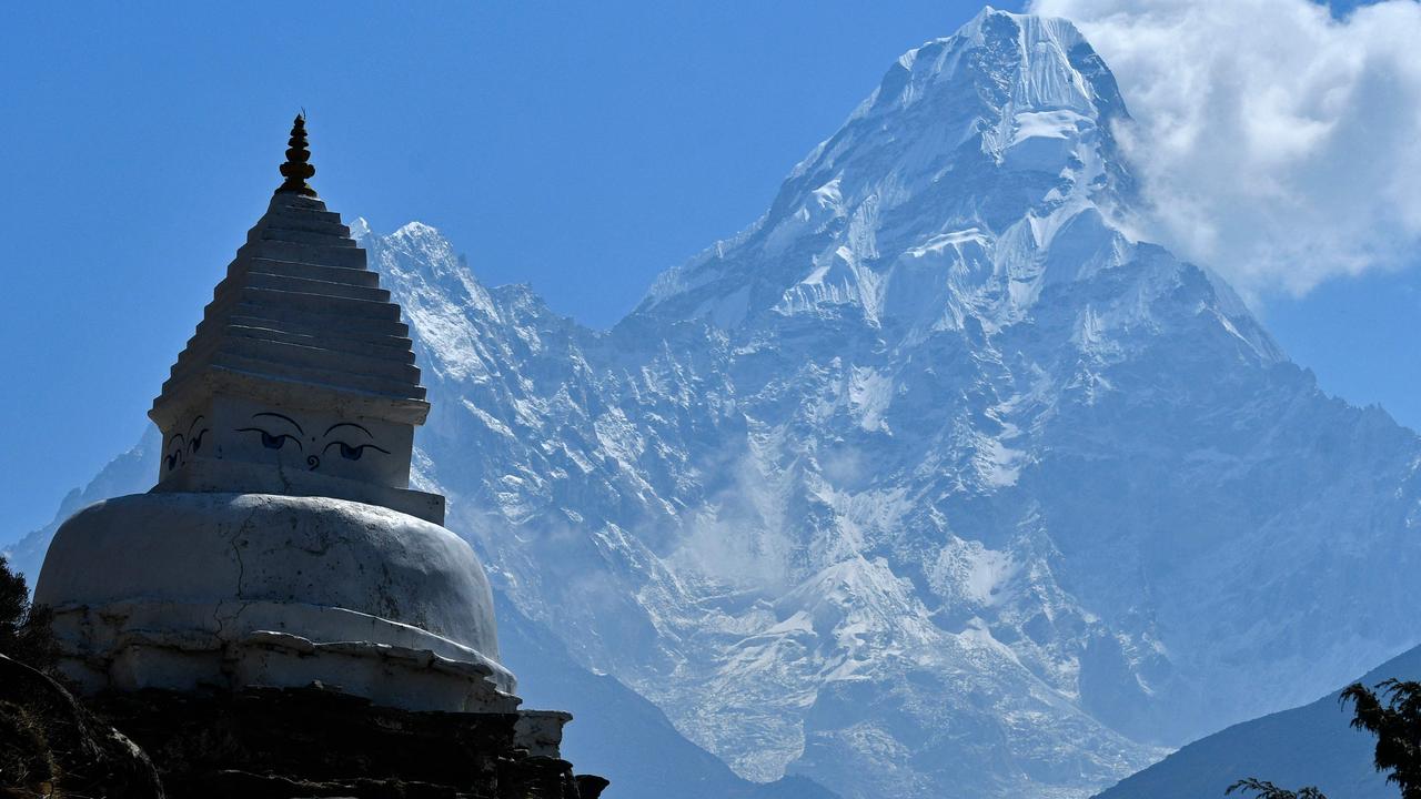 Nepal’s breathtaking mountains were not enough to shield it from a fresh surge of COVID-19. (Photo by Prakash MATHEMA / AFP)