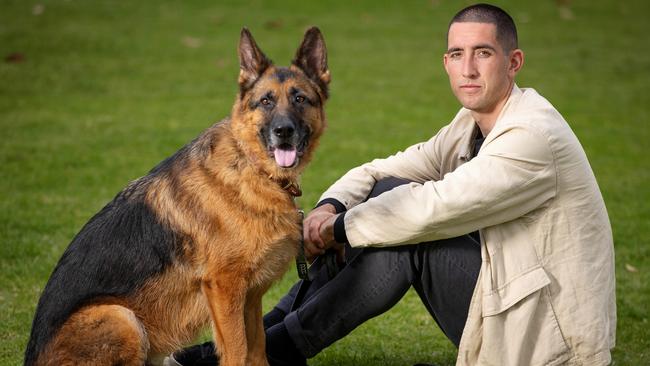 Weitering, pictured with his dog, Beau, in Elwood, lost his life savings. Picture: Mark Stewart