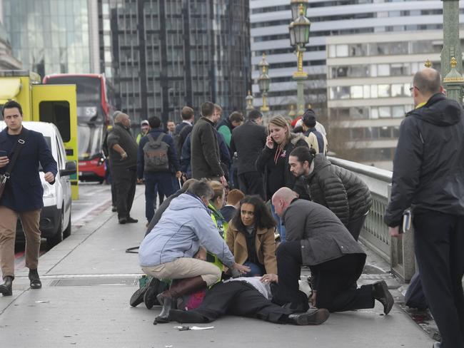 Injured people are assisted after pedestrians were mowed down on Westminster Bridge in London. Picture: Reuters/Toby Melville