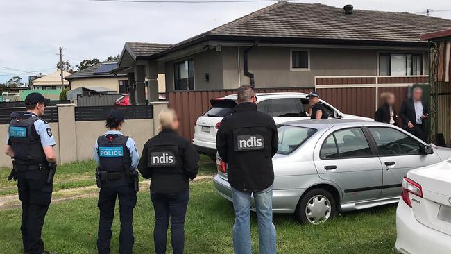 Police and NDIS fraud officers from Operation Pegasus investigating NDIS fraud. Picture: Australian Federal Police