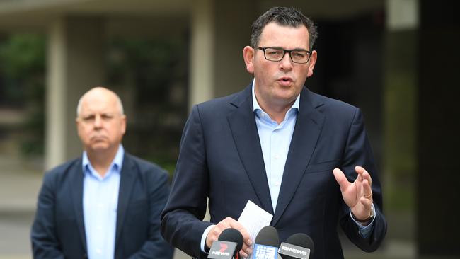 Victorian Premier Daniel Andrews (right) and Treasurer Tim Pallas speaking to the media during a press conference in March.