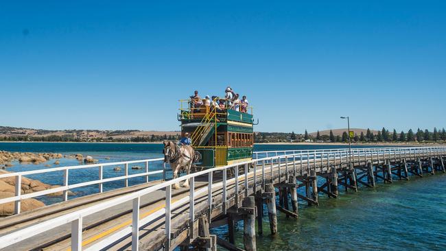 Horse-drawn tram over the causeway to Granite Island, Victor Harbor. Supplied by South Australian Tourism Commission