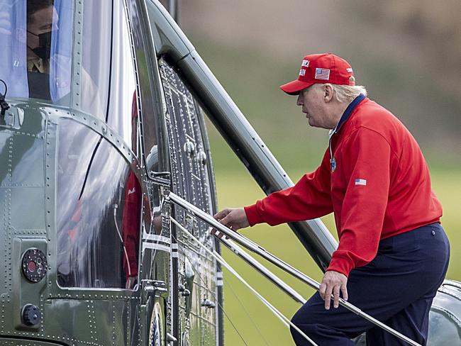 US President Donald Trump walks to Marine One at Trump National Golf Club in Virginia on his way to Camp David for the weekend after playing golf. Picture: AFP