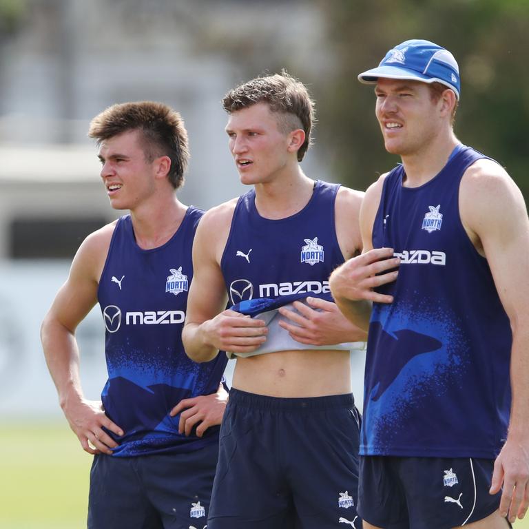 McKercher (left) during his first training session as a North Melbourne player with Pick 4 Zane Duursma (centre) and mature-age recruit Toby Pink. Picture: David Crosling