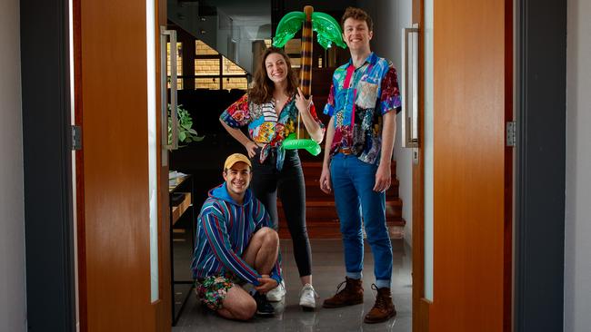 The 91-Storey Treehouse cast members Sam Welsh, Rebecca Rolle and Teale Howie at the front door of house at Tennyson where they have been in isolation for two weeks. Picture: Matt Turner