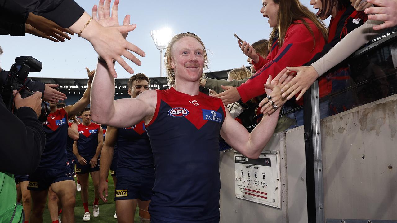 MELBOURNE, AUSTRALIA - APRIL 02: Clayton Oliver of the Demons celebrates with fans after winning the round three AFL match between Melbourne Demons and Sydney Swans at Melbourne Cricket Ground, on April 02, 2023, in Melbourne, Australia. (Photo by Daniel Pockett/Getty Images)