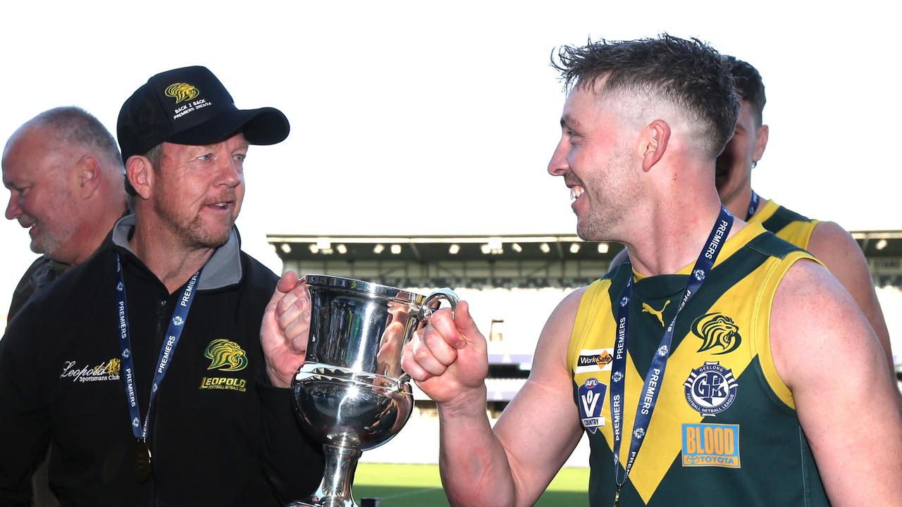 Leopold coach Garry Hocking with Lions captain Marcus Thompson and the GFNL premiership cup. Picture: Mike Dugdale