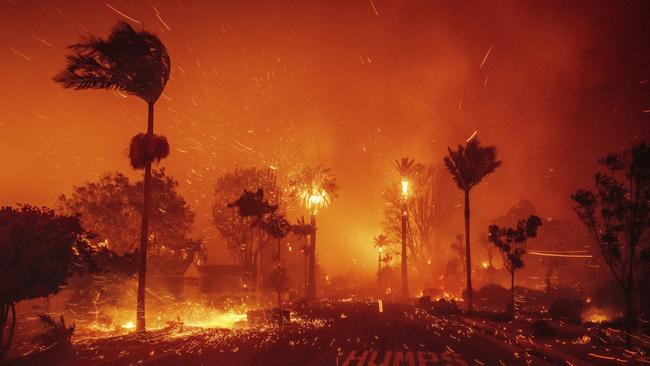 The Palisades Fire ravages a neighbourhood amid high winds. Picture: AP