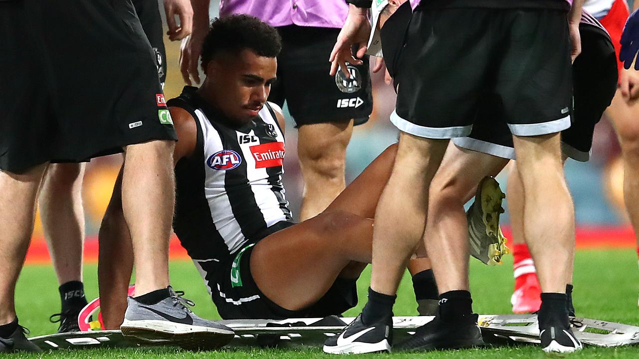 Isaac Quaynor was stretchered off after his leg was split open. (Photo by Jono Searle/AFL Photos/via Getty Images)