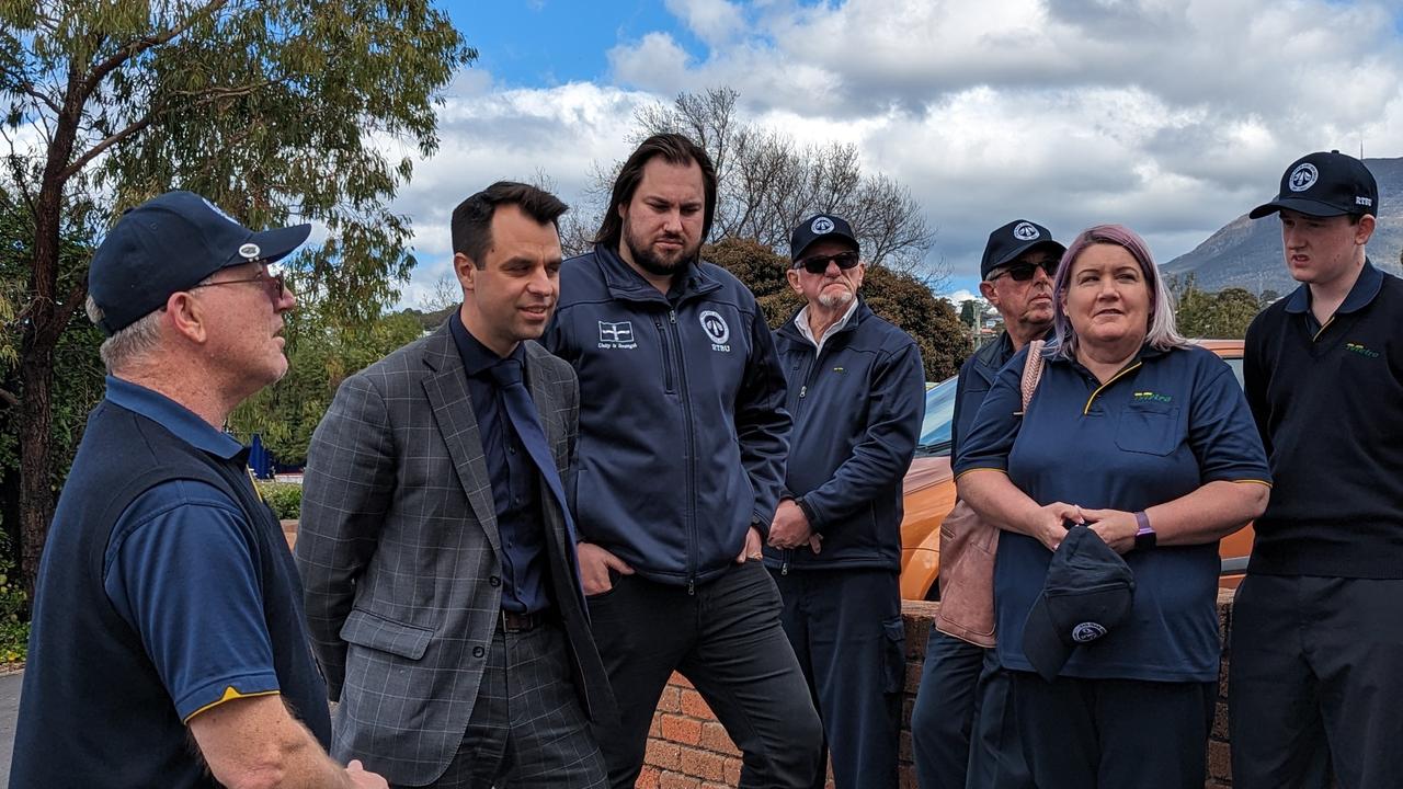 Tasmanian Labor's transport spokesman Josh Willie MLC (second from left) and RTBU Tasmania organiser Byron Cubit (third from left) speaking with Metro bus drivers outside the Springfield depot, Moonah. Picture: Alex Treacy