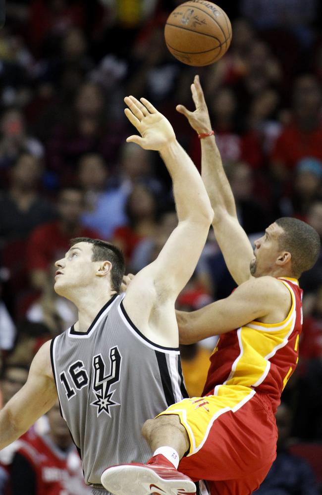 Houston Rockets guard Francisco Garcia shoots around San Antonio’s Aaron Baynes.