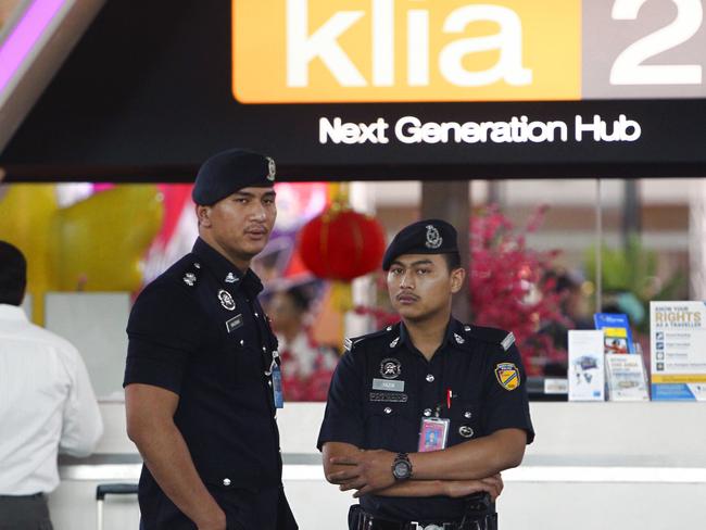Police officers patrol inside the Kuala Lumpur International Airport in Sepang, Malaysia where Kim Jong-un’s half-brother was killed. Picture: AP Photo.