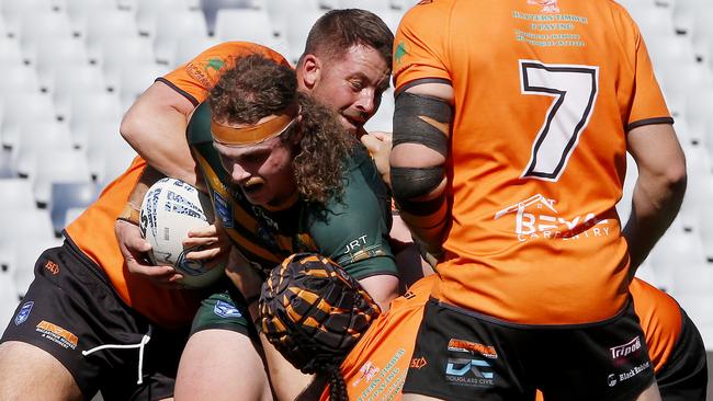 Mittagong's Nicholas Belmonteis tackled. Picture: John Appleyard