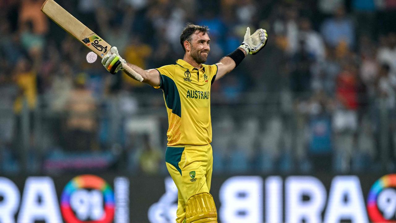 TOPSHOT - Australia's Glenn Maxwell celebrates after winning the 2023 ICC Men's Cricket World Cup one-day international (ODI) match between Australia and Afghanistan at the Wankhede Stadium in Mumbai on November 7, 2023. (Photo by INDRANIL MUKHERJEE / AFP) / -- IMAGE RESTRICTED TO EDITORIAL USE - STRICTLY NO COMMERCIAL USE --