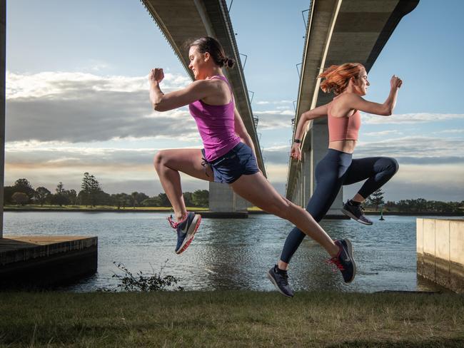 10-08-2021 Runners Sophie Mulheran and Rory McGahan under the Gateway Bridge. The Bridge to Brisbane run has been delayed to November. Picture: Brad Fleet