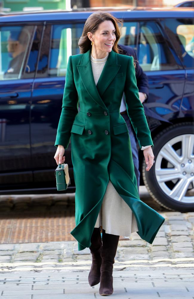 January 31: Keeping warm in the winter months, the princess wore a full length dark green coat, teamed with knee length brown boots and a matching green mini handbag. Picture: Chris Jackson/Getty Images