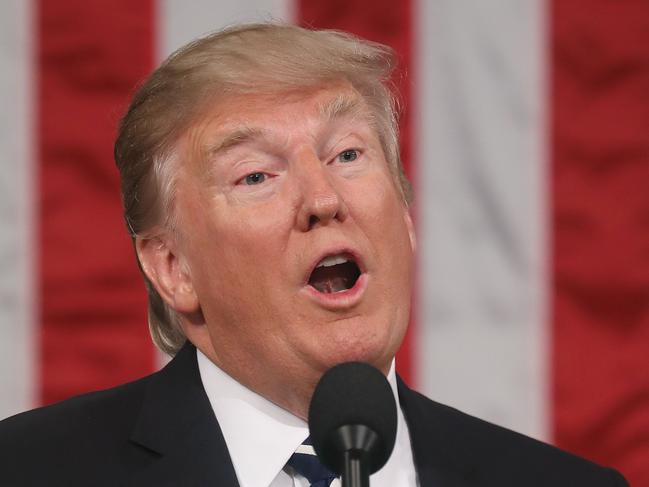 US President Donald J. Trump delivers his first address to a joint session of Congress from the floor of the House of Representatives in Washington, DC, USA, 28 February 2017. / AFP PHOTO / EPA POOL / JIM LO SCALZO