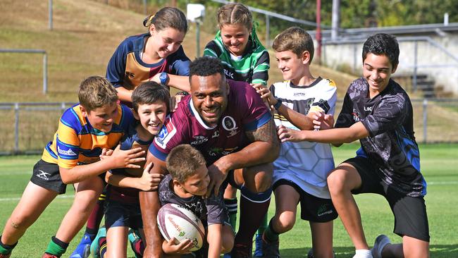 New Reds captain Samu Kerevi with Sam Coleman, Harry Andrew, Riley Andrew, Lucy Coleman, Cyrus Te Popo, Maddy Andrew and Awanui Te Popo at Ballymore. Picture: John Gass