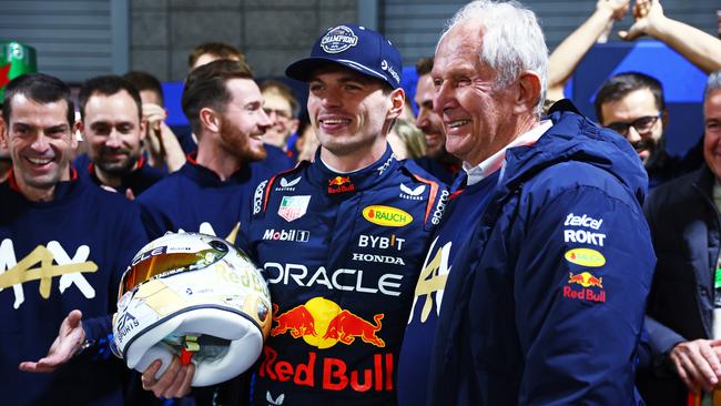 F1 World Drivers Champion Max Verstappen with Oracle Red Bull Racing consultant Helmut Marko and team members. Picture: Getty Images