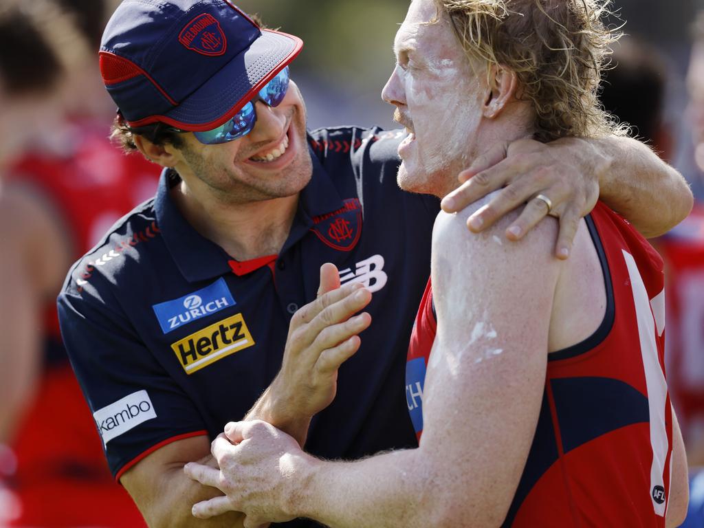 Christian Petracca give Oliver a hug at quarter time. Picture: Michael Klein