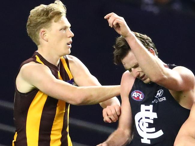 MELBOURNE, AUSTRALIA - AUGUST 19:   Jed Lamb of the Blues is pushed by James Sicily of the Hawks during the round 22 AFL match between the Carlton Blues and the Hawthorn Hawks at Etihad Stadium on August 19, 2017 in Melbourne, Australia.  (Photo by Scott Barbour/Getty Images)